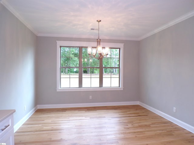 291 Robbins Rd, Chesnee, SC 29323 - empty room with a chandelier, light wood-type flooring, crown molding, and baseboards