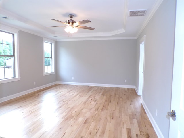 291 Robbins Rd, Chesnee, SC 29323 - unfurnished room with light wood-type flooring, a ceiling fan, a tray ceiling, ornamental molding, and baseboards