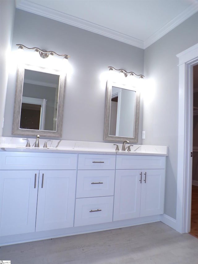 291 Robbins Rd, Chesnee, SC 29323 - full bathroom with double vanity, crown molding, wood finished floors, and baseboards