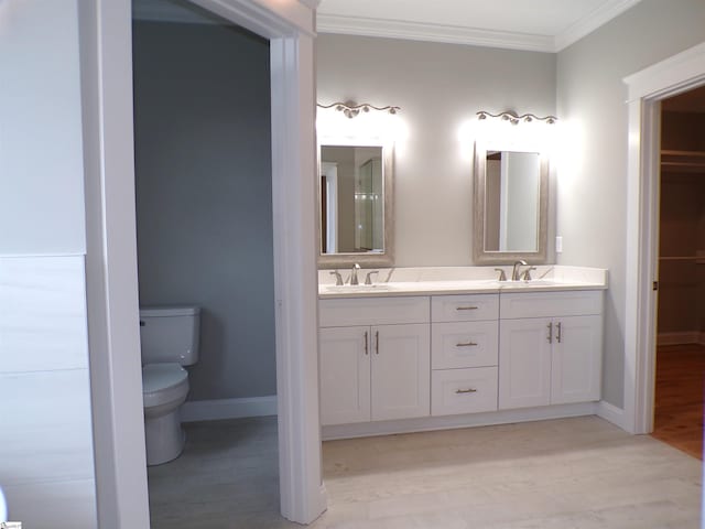 291 Robbins Rd, Chesnee, SC 29323 - full bathroom featuring crown molding, double vanity, wood finished floors, toilet, and baseboards