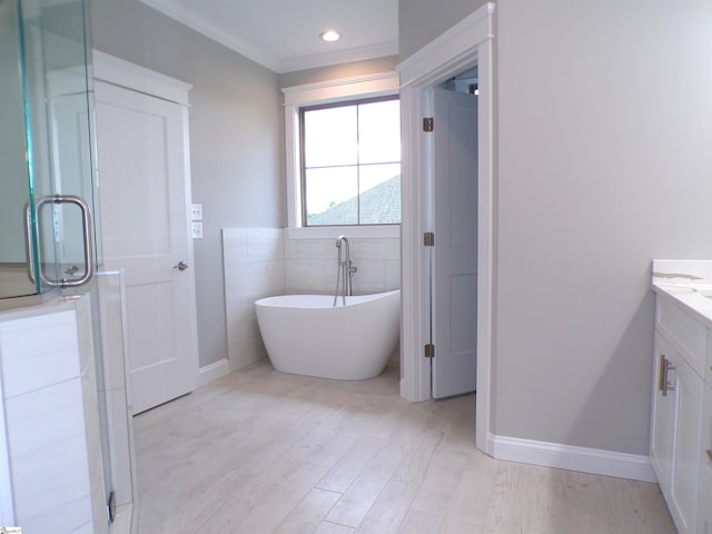 291 Robbins Rd, Chesnee, SC 29323 - full bath featuring vanity, a soaking tub, wood finished floors, a stall shower, and baseboards
