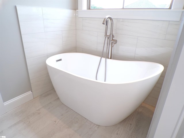 291 Robbins Rd, Chesnee, SC 29323 - bathroom with a freestanding bath and tile walls
