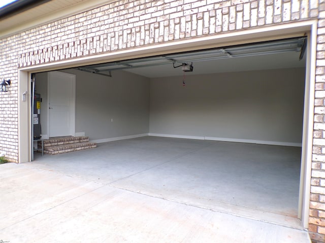 291 Robbins Rd, Chesnee, SC 29323 - garage with driveway, a garage door opener, and water heater