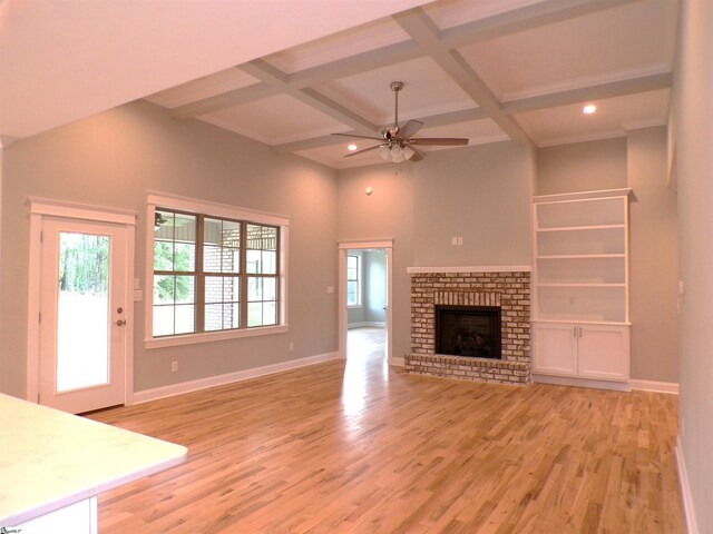 291 Robbins Rd, Chesnee, SC 29323 - unfurnished living room featuring a ceiling fan, light wood-style flooring, coffered ceiling, baseboards, and beamed ceiling