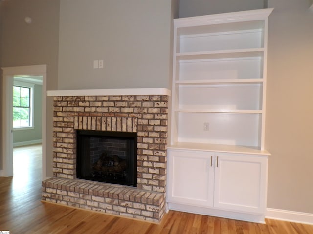 291 Robbins Rd, Chesnee, SC 29323 - detailed view of wood finished floors, a fireplace, and baseboards