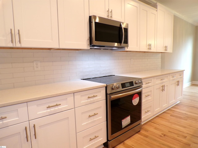 291 Robbins Rd, Chesnee, SC 29323 - kitchen featuring appliances with stainless steel finishes, light wood-style floors, and white cabinetry