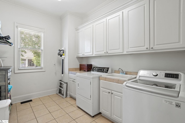 1 Riverstone Way, Greer, SC 29651 - washroom featuring cabinet space, washer and clothes dryer, light tile patterned floors, crown molding, and baseboards