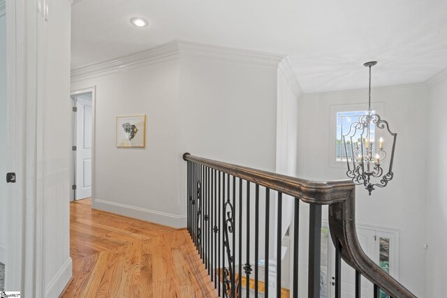 1 Riverstone Way, Greer, SC 29651 - hall with a chandelier, an upstairs landing, ornamental molding, light wood-style flooring, and baseboards