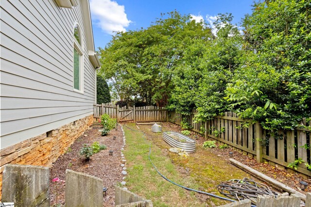 1 Riverstone Way, Greer, SC 29651 - fenced backyard featuring a garden