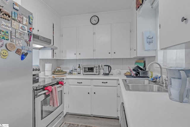 273 Cedar Springs Rd, Spartanburg, SC 29302 - kitchen with stainless steel appliances, under cabinet range hood, a sink, white cabinetry, and crown molding