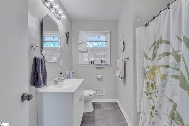 273 Cedar Springs Rd, Spartanburg, SC 29302 - bathroom featuring vanity, toilet, baseboards, and a shower with shower curtain