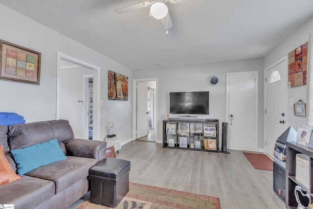 273 Cedar Springs Rd, Spartanburg, SC 29302 - living room with wood finished floors, ceiling fan, baseboards, and a textured ceiling