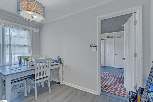 273 Cedar Springs Rd, Spartanburg, SC 29302 - home office featuring wood finished floors, crown molding, a textured ceiling, and baseboards