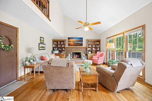 3 Staten Ln, Taylors, SC 29687 - living area with light wood-style floors, high vaulted ceiling, a ceiling fan, baseboards, and a brick fireplace