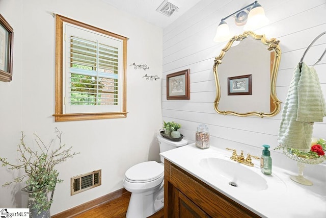 3 Staten Ln, Taylors, SC 29687 - bathroom with vanity, toilet, wood finished floors, and wood walls