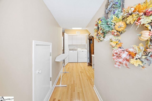 3 Staten Ln, Taylors, SC 29687 - corridor featuring washing machine and clothes dryer and light wood finished floors