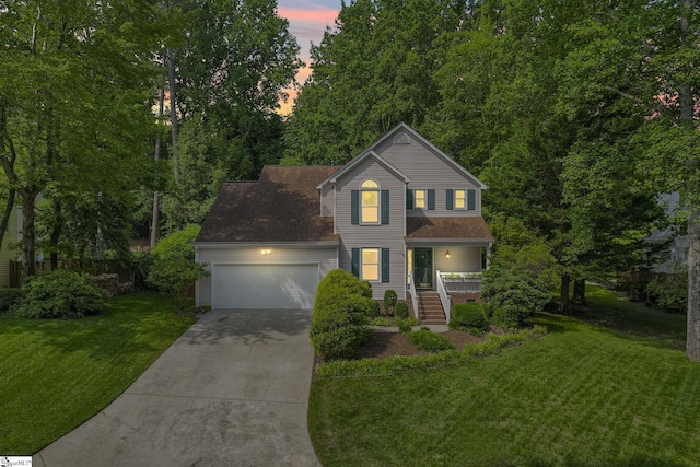 411 Wild Horse Creek Dr, Simpsonville, SC 29680 - traditional-style home with concrete driveway, a garage, covered porch, and a lawn