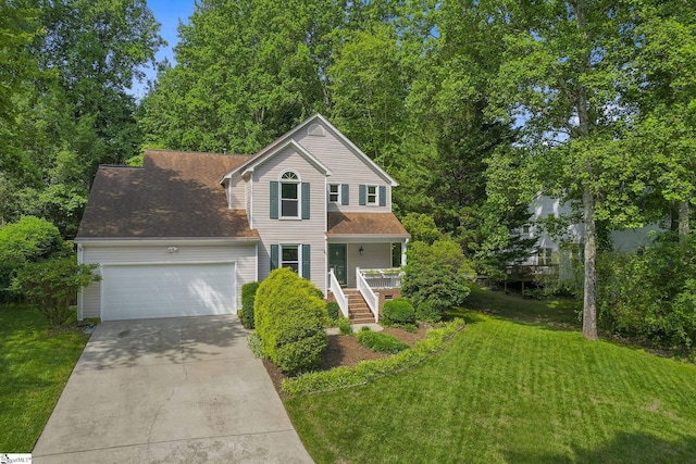 411 Wild Horse Creek Dr, Simpsonville, SC 29680 - traditional home with a garage, concrete driveway, covered porch, and a front lawn