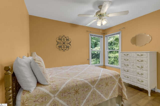 411 Wild Horse Creek Dr, Simpsonville, SC 29680 - bedroom with wood finished floors, baseboards, and ceiling fan