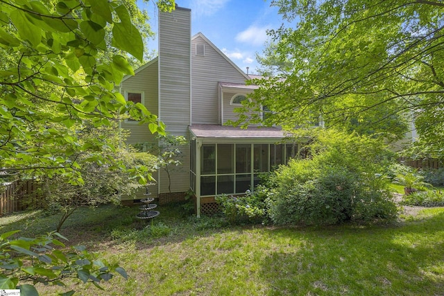 411 Wild Horse Creek Dr, Simpsonville, SC 29680 - back of property featuring a sunroom and a chimney