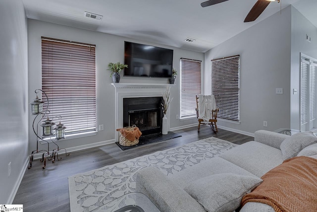 349 Hamilton Pkwy, Easley, SC 29642 - living area featuring ceiling fan, wood finished floors, a fireplace with raised hearth, baseboards, and vaulted ceiling