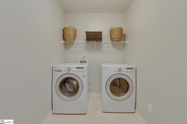 349 Hamilton Pkwy, Easley, SC 29642 - laundry area with washing machine and dryer and baseboards