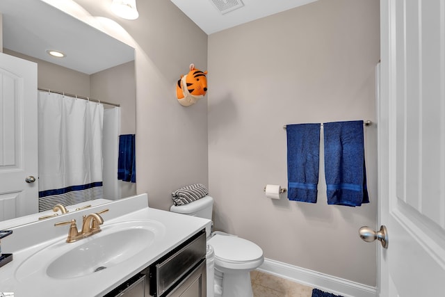 201 Wiscasset Way, Greenville, SC 29615 - bathroom with vanity, toilet, tile patterned floors, and baseboards