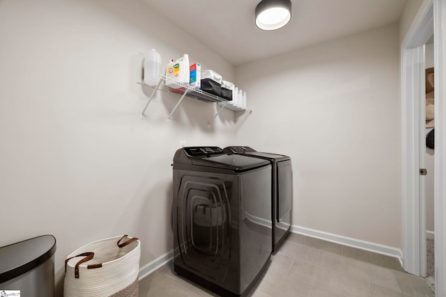 813 Elgon Walk Dr, Fountain Inn, SC 29644 - laundry area featuring washer and dryer, baseboards, and light tile patterned floors