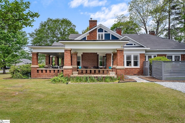 227 S Main St, Anderson, SC 29654 - craftsman house featuring brick siding, a chimney, and covered porch