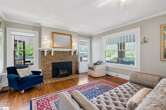 227 S Main St, Anderson, SC 29654 - living room featuring wood finished floors, crown molding, baseboards, and a ceiling fan