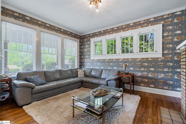 227 S Main St, Anderson, SC 29654 - living room featuring wallpapered walls, wood-type flooring, crown molding, and baseboards