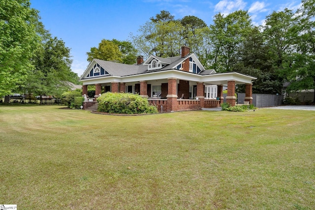 227 S Main St, Anderson, SC 29654 - view of front of home featuring a porch, brick siding, and a chimney