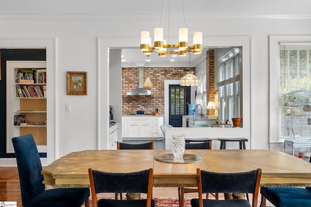 227 S Main St, Anderson, SC 29654 - dining room with ornamental molding, plenty of natural light, a chandelier, and wood finished floors
