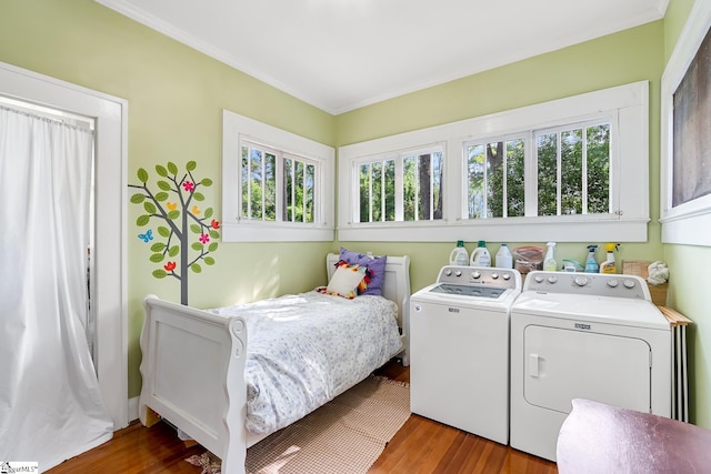 227 S Main St, Anderson, SC 29654 - bedroom featuring washer and dryer, wood finished floors, and crown molding