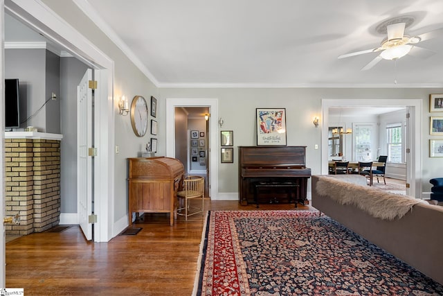 227 S Main St, Anderson, SC 29654 - living area with a ceiling fan, dark wood finished floors, crown molding, and baseboards