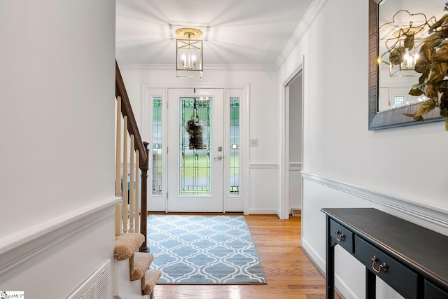 207 White Water Ct, Greer, SC 29650 - foyer entrance with stairs, light wood-type flooring, ornamental molding, a chandelier, and wainscoting