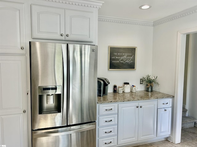 207 White Water Ct, Greer, SC 29650 - kitchen with stainless steel refrigerator with ice dispenser, light stone countertops, white cabinets, crown molding, and recessed lighting