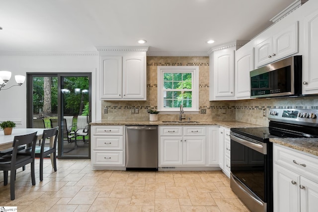 207 White Water Ct, Greer, SC 29650 - kitchen with stainless steel appliances, a sink, backsplash, light stone countertops, and stone tile floors