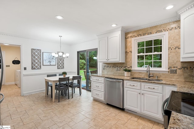 207 White Water Ct, Greer, SC 29650 - kitchen featuring stainless steel dishwasher, a sink, tasteful backsplash, a chandelier, and washer and clothes dryer