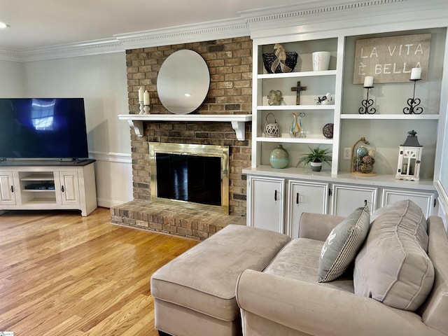 207 White Water Ct, Greer, SC 29650 - living room with ornamental molding, light wood-type flooring, and a brick fireplace