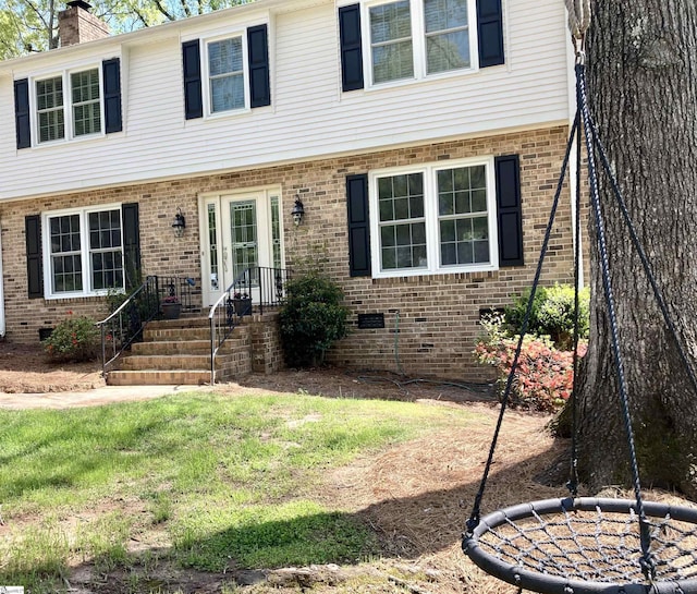 207 White Water Ct, Greer, SC 29650 - colonial house with a chimney, brick siding, and a front lawn