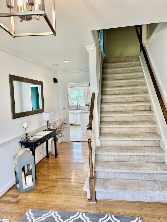 207 White Water Ct, Greer, SC 29650 - staircase featuring crown molding, wood finished floors, and recessed lighting