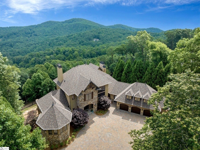 58 Wild Ginger Rd, Landrum, SC 29356 - aerial view of property and surrounding area featuring a heavily wooded area and a mountain backdrop