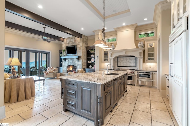 58 Wild Ginger Rd, Landrum, SC 29356 - kitchen with a sink, a fireplace, ceiling fan, healthy amount of natural light, and recessed lighting