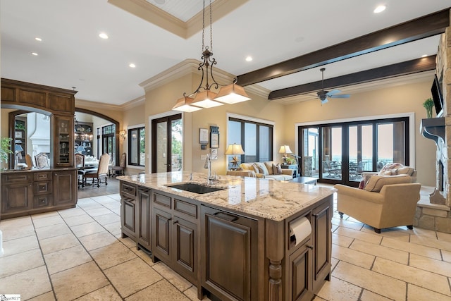 58 Wild Ginger Rd, Landrum, SC 29356 - kitchen with a sink, arched walkways, recessed lighting, an island with sink, and ornamental molding
