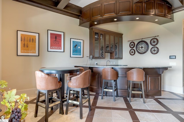 58 Wild Ginger Rd, Landrum, SC 29356 - indoor wet bar featuring baseboards, inlaid floor details, and light tile patterned floors