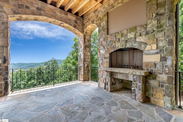 58 Wild Ginger Rd, Landrum, SC 29356 - view of patio with an outdoor stone fireplace and a mountain view