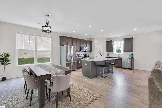 115 River Trace Loop, Simpsonville, SC 29680 - dining area featuring light wood-style flooring, recessed lighting, baseboards, and a chandelier