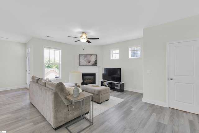 115 River Trace Loop, Simpsonville, SC 29680 - living area with healthy amount of natural light, light wood-style flooring, and a glass covered fireplace