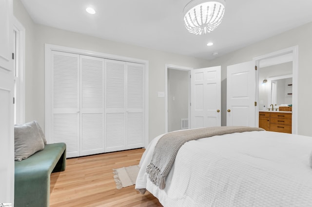 116 Arnold Dr, Anderson, SC 29621 - bedroom featuring light wood-type flooring, a closet, a chandelier, recessed lighting, and a sink